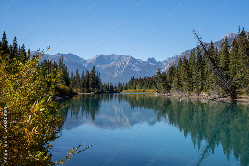 mountain reflection over the bow river in banff national park