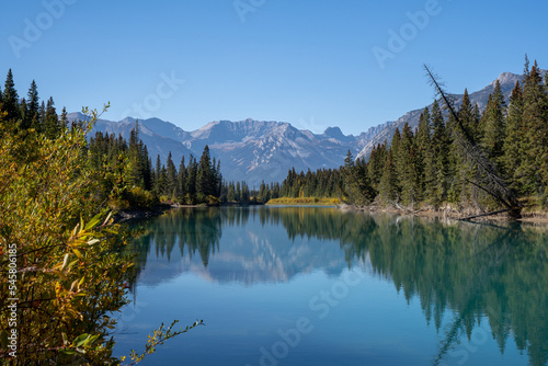 mountain reflection over the bow river in banff national park