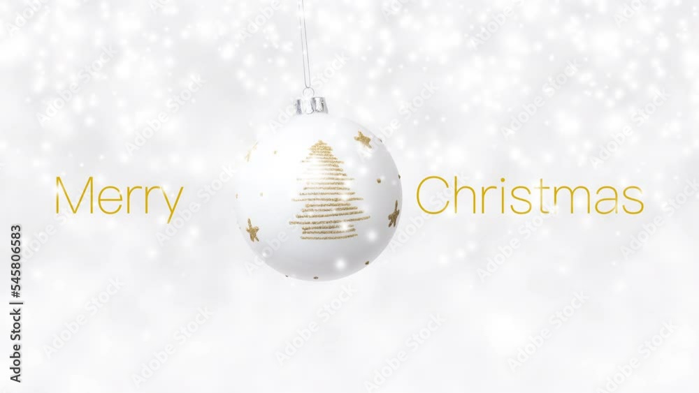 Merry Christmas text and hanging white ball decorated with shiny golden tree dangling isolated on snowing background, white Christmas concept template, greeting gift card or promo advertising banner