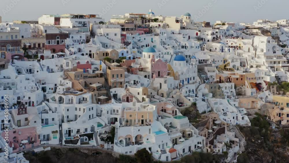 Aerial view of Oia town with its classic greek whitewashed houses and blue domed churches, Santorini, Greece Aerial view of Oia town with its classic greek whitewashed houses and blue domed churches, Santorini, Greece