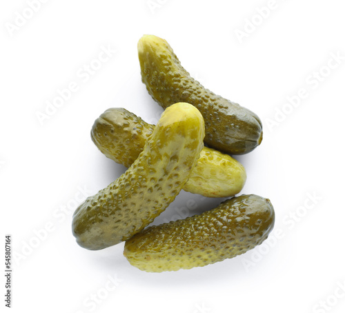 Pile of tasty pickled cucumbers on white background, top view