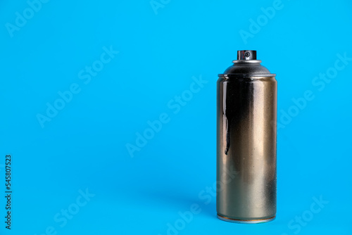 Used can of spray paint on light blue background. Space for text