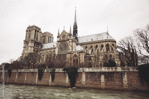 Paris, France, Notre Dame de Paris facade, city panorama with river view. © Tsyb Oleh