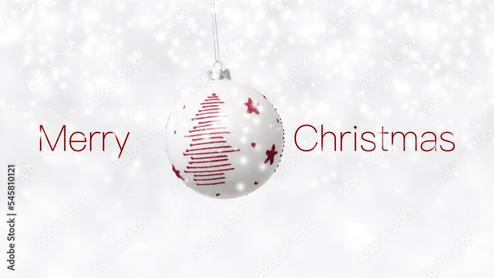Merry Christmas text and hanging white ball decorated with shiny red tree dangling isolated on snowing background, white Christmas concept template for greeting gift card or promo advertising banner