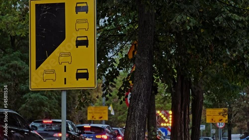 Zipper Merging Lane Road Caution Sign Standing by Busy Street before Roadwork Repairs