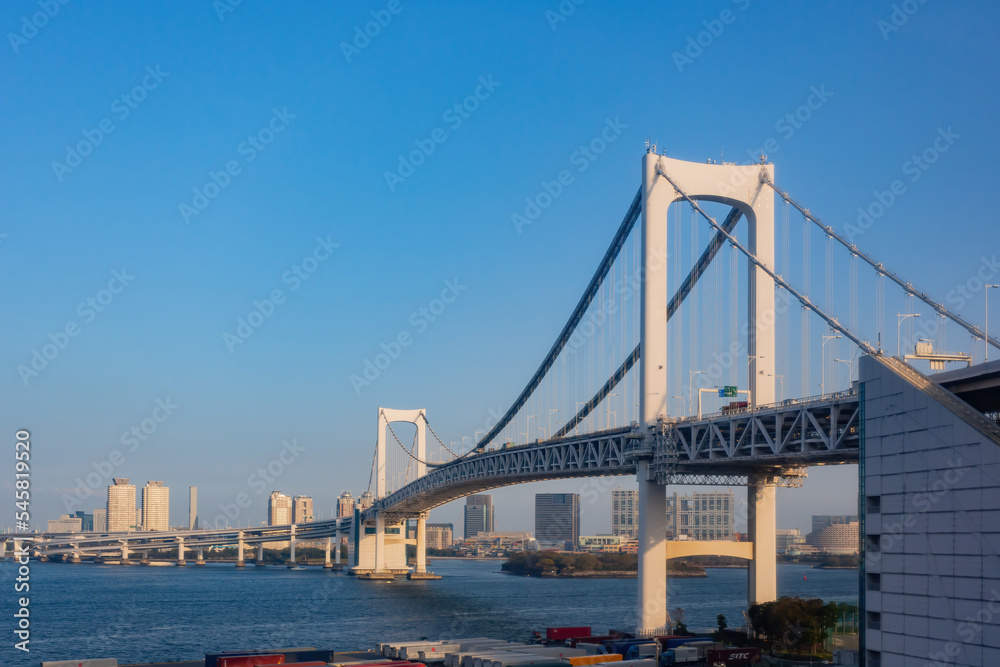 Sunny view of the Rainbow Bridge and cityscape Sunny view of the Rainbow Bridge and cityscape