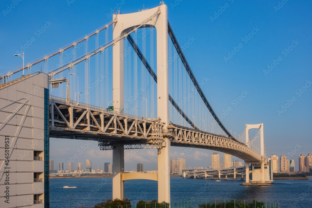 Sunny view of the Rainbow Bridge and cityscape Sunny view of the Rainbow Bridge and cityscape