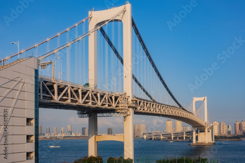 Sunny view of the Rainbow Bridge and cityscape