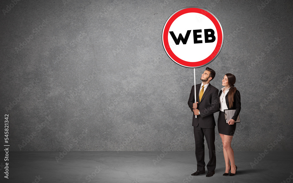 Young business person holdig traffic sign Young business person holdig traffic sign