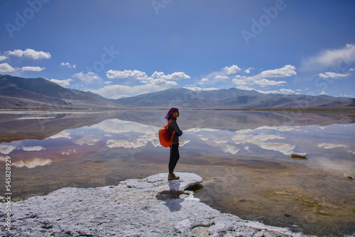 Trekker enjoying the view of Tso Kar Lake, Ladakh, India