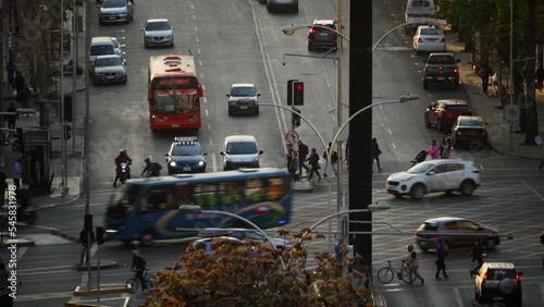 Wallpaper Mural Vehicles Driving In Busy Streets With Pedestrians Crossing At The Intersection At Sunset. high angle Torontodigital.ca