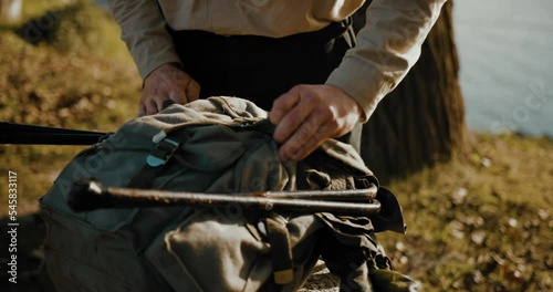 Close Up Shot Of Hiker Tying And Closing Well His Backpack To Start His Long Trip, Vogelberg  photo
