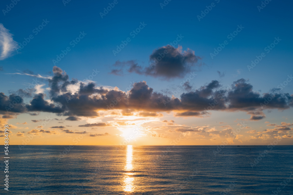 Sea beach with sky sunset or sunrise. Cloudscape over the sunset sea. Sunset at tropical beach. Nature sunset landscape of sea background wallpaper.