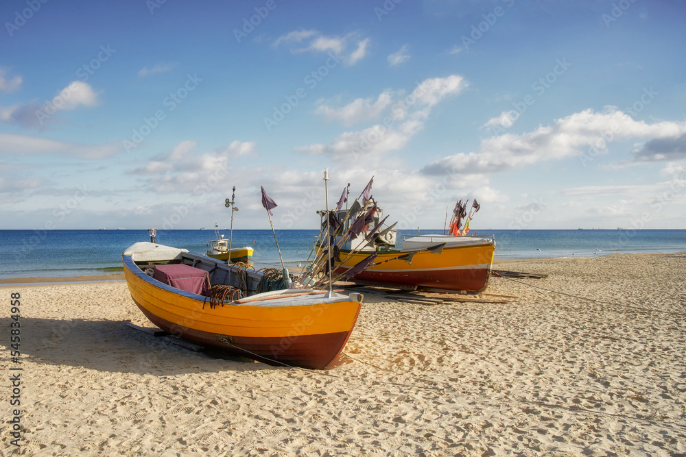 The Baltic Sea, the Polish city of Sopot and on the beach, a fishing boat	