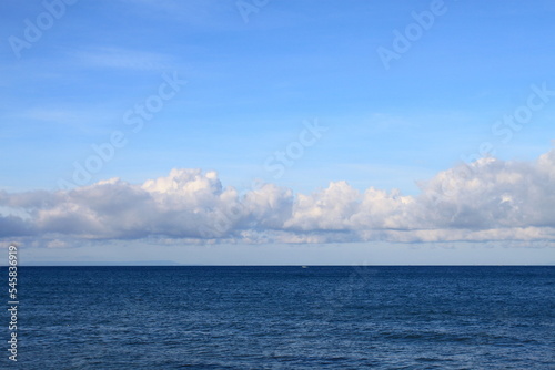 Blue sky with clouds over the sea. Lombok island, Indonesia.