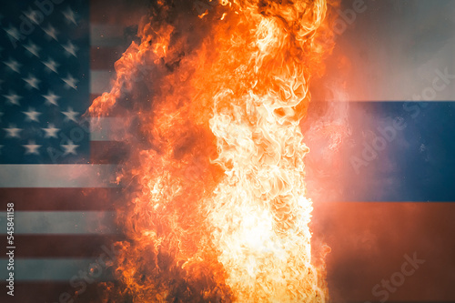 USA and Russia flags on burning dark background Fototapet