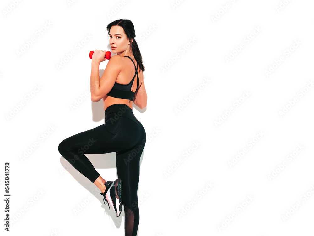 Woman in black sportive clothes have exercise with dumbbells in