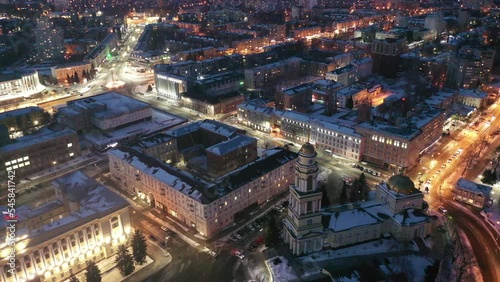 View from drone of illuminated Cathedral of Nativity of Christ on main square in Russian city of Lipetsk on winter evening photo