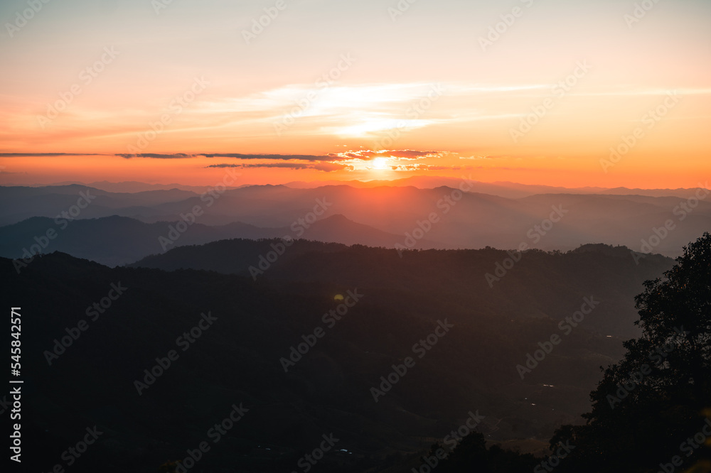 Scenic View Of Mountains During Sunset Scenic View Of Mountains During Sunset