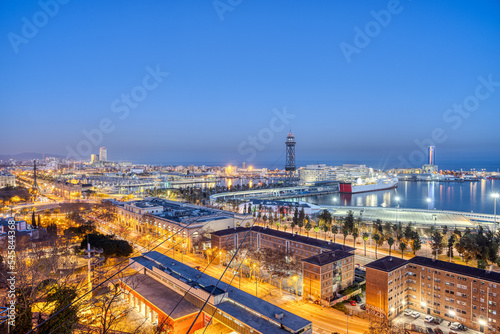 Photography The skyline of Barcelona with parts of the harbour at dusk