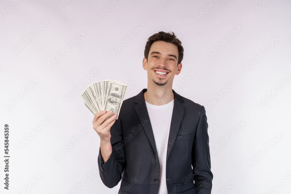 Portrait of a cheerful man holding dollar bills over white background Portrait of a cheerful man holding dollar bills over white background