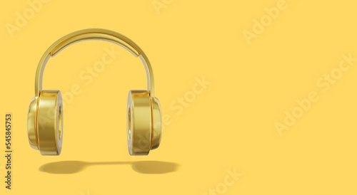 Realistic golden headphones on yellow background with space for text. Front view. 3d rendering.