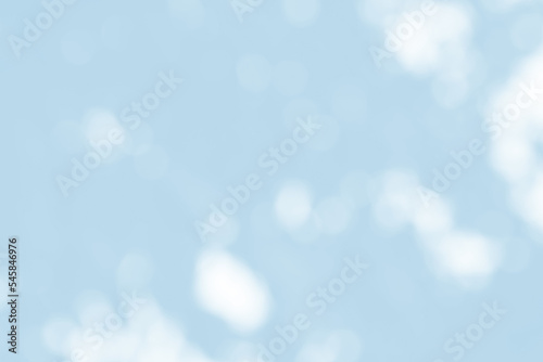 Abstract light blue blur bokeh for background, light blur on high light blue gradient abstract background in central design for presentation.