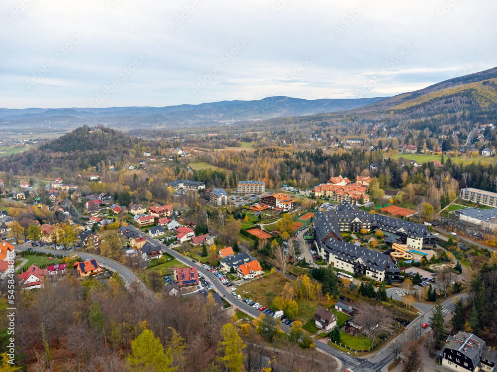 Aerial view of a traditional residential area in the mountains. Looking straight down in the style of a satellite image, the houses look like a miniature village.