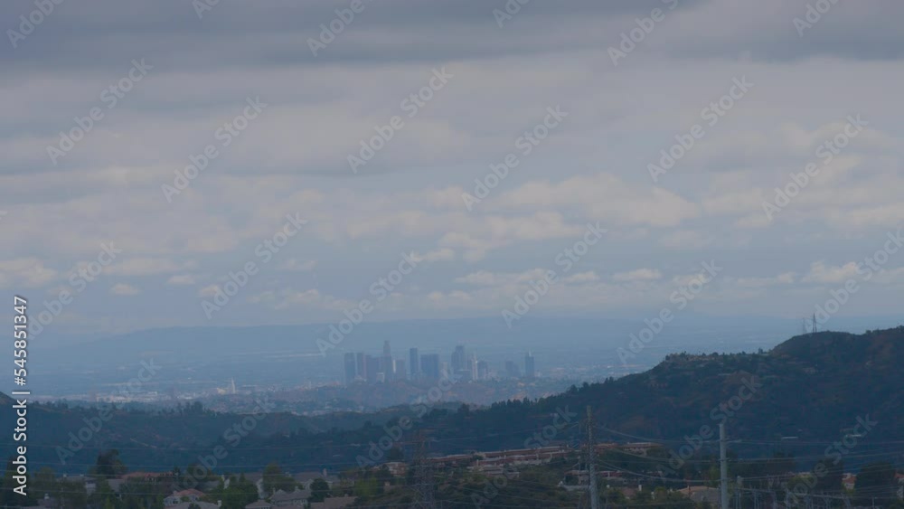 Time lapse of distance shot of downtown Los Angeles while clouds are flying over the tops of the buildings located in Echo Mountain Trails California. Time lapse of distance shot of downtown Los Angeles while clouds are flying over the tops of the buildings located in Echo Mountain Trails California.