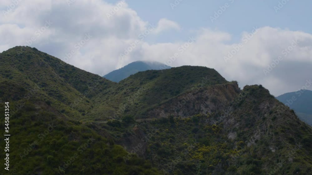 time lapse shot of Echo Mountain with clouds flying over the tops and peak while the shadows of the clouds are racing on the ground located in Echo Mountains Trails California. time lapse shot of Echo Mountain with clouds flying over the tops and peak while the shadows of the clouds are racing on the ground located in Echo Mountains Trails California.
