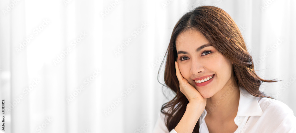 Portrait of smiling cheerful beautiful pretty asian woman clean fresh healthy white skin posing smile in pajamas white clothes.Girl felling relax and enjoy time on the bed at home.asia beauty Portrait of smiling cheerful beautiful pretty asian woman clean fresh healthy white skin posing smile in pajamas white clothes.Girl felling relax and enjoy time on the bed at home.asia beauty