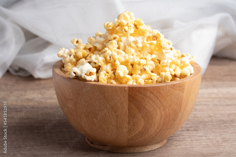 Popcorn in a wooden cup. Snacks. Popcorn in a wooden cup. Snacks.