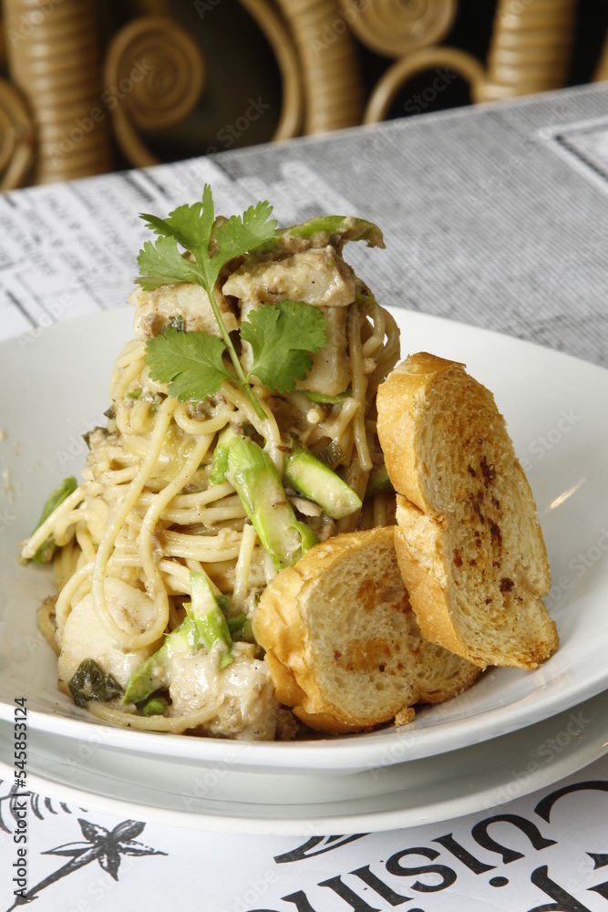 Chicken pasta dish with vertical plating Chicken pasta dish with vertical plating