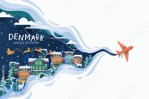 Airplane flying to denmark landmark over city buildings in winter 