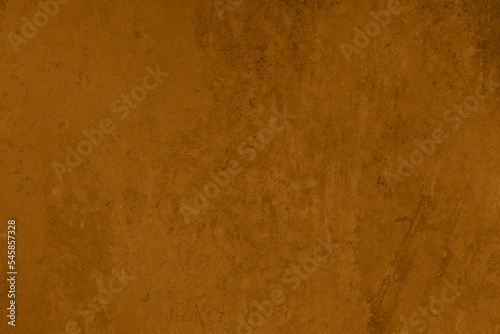 Saturated pastel brown colored low contrast Concrete textured background. Empty colourful wall texture with copy space for text overlay and mockups. 2023, 2024 color trend