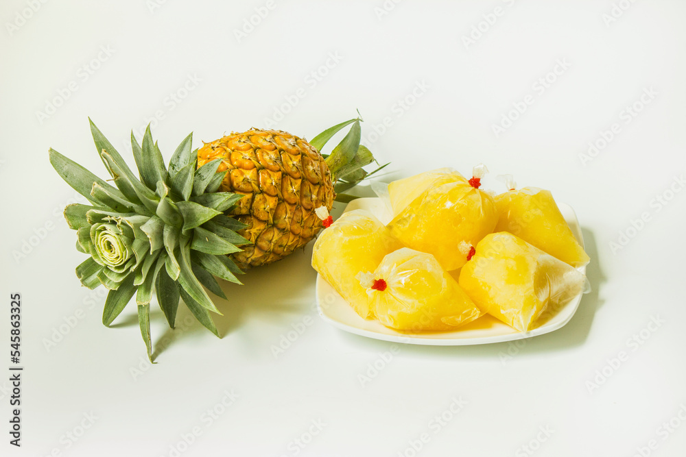 Iced pineapple juice packed in a homemade-style frozen plastic bag. Iced pineapple juice packed in a homemade-style frozen plastic bag.