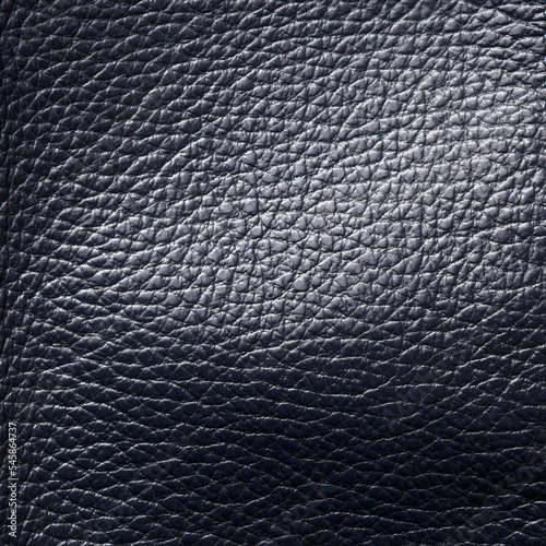 Black leather material texture for use as background.
