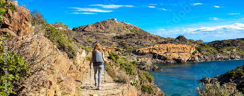 Foto Woman walking on path- Costa brava in Spain