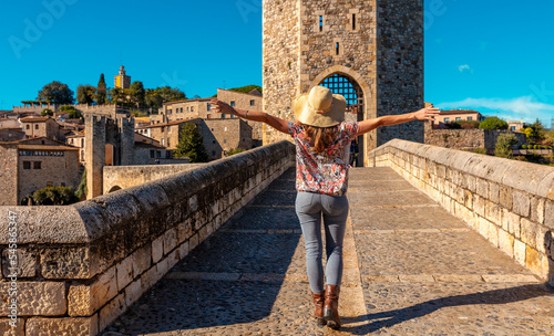 Woman tourist visiting Besalu- Catalonia in Spain photo