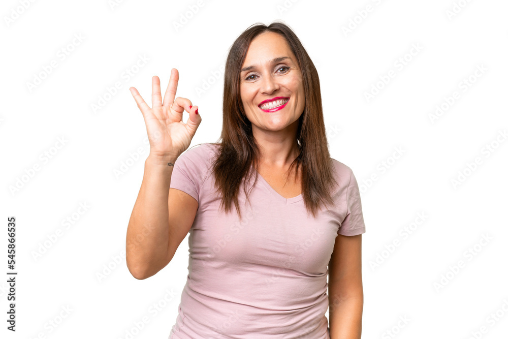 Middle-aged caucasian woman over isolated background showing ok sign with fingers Middle-aged caucasian woman over isolated background showing ok sign with fingers