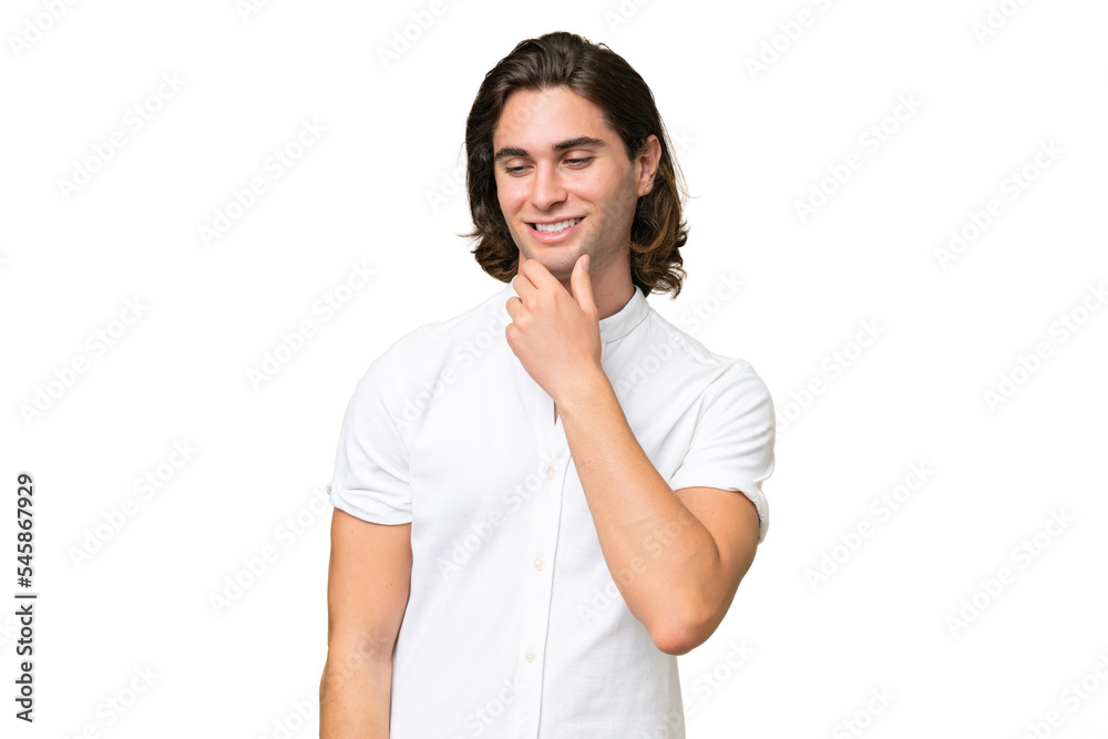 Young caucasian man isolated on green chroma background looking to the side and smiling Young caucasian man isolated on green chroma background looking to the side and smiling