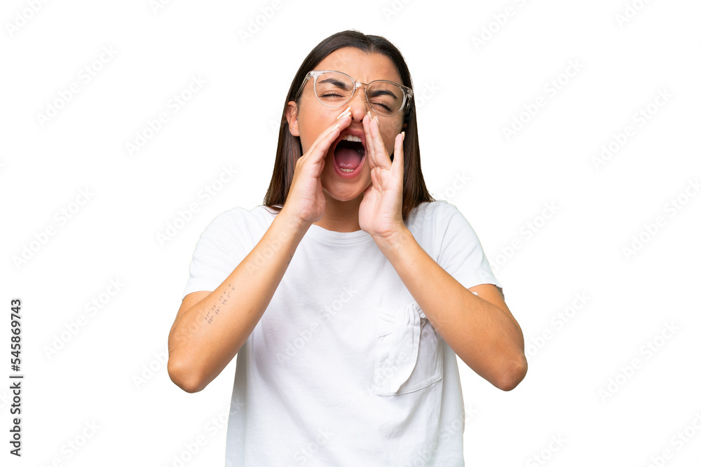 Young caucasian woman isolated on green chroma background shouting and announcing something Young caucasian woman isolated on green chroma background shouting and announcing something