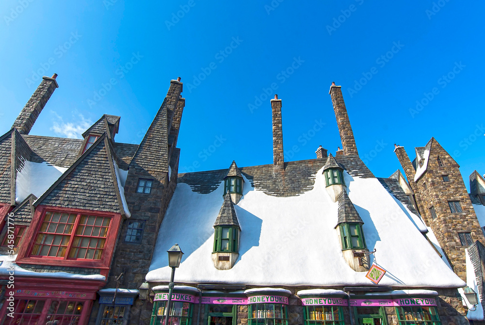 Naklejka premium OSAKA - JAN 10: Roofs of houses covered by snow in Hogsmeade Village of Harry Potter themed attractions at Universal Studios Adventure theme park in Osaka on January 10. 2017 in Japan