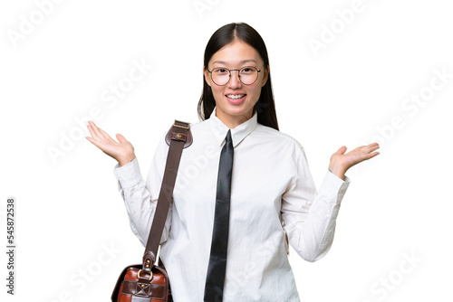 Young Asian business woman over isolated background with shocked facial expression