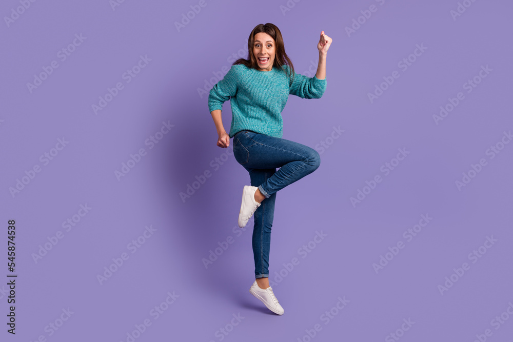 Full size photo of young excited woman rejoice fists hands triumph luck isolated over violet color background