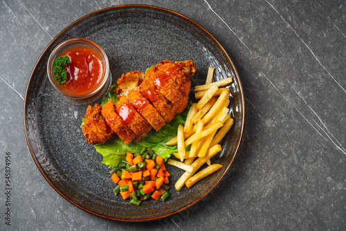 Bilde på lerret A chicken cordon bleu or schnitzel cordon bleu is a dish of meat wrapped around cheese (or with cheese filling), then breaded and pan-fried or deep-fried