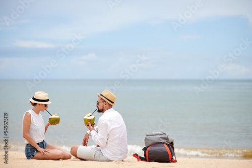 Couple Enjoying Refreshing Coconut Drinks