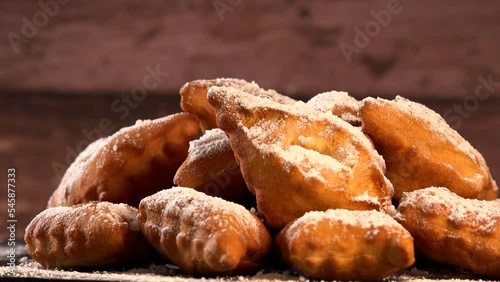TRADITIONAL WONDERS OF SOUTH-WESTERN FRANCE, SPRINKLED WITH ICING SUGAR AND FLAVOURED WITH RUM AND ORANGE FLOWER WATER, High quality video photo