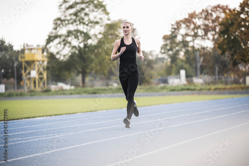 Wallpaper Mural Sportswoman running on sports track Torontodigital.ca