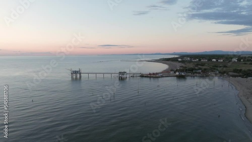 Wallpaper Mural Aerial view slow motion of fishing huts on shores of estuary at sunset,italian fishing machine, called "trabucco" Ravenna near Comacchio valley. Torontodigital.ca